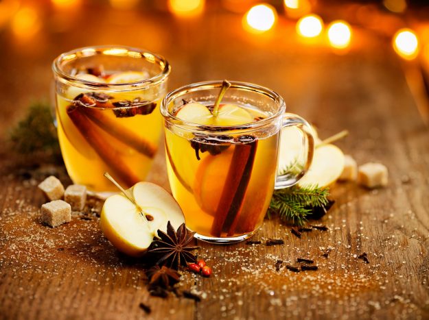 Hot cider with spicy seasonings and citrus fruits